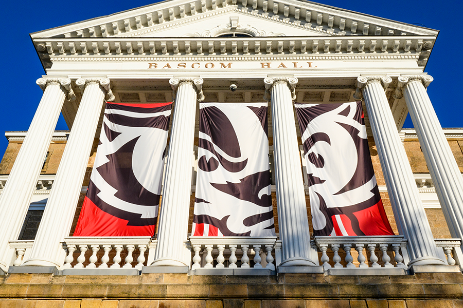 Exterior photo of Bascom Hall with Bucky Badger banner